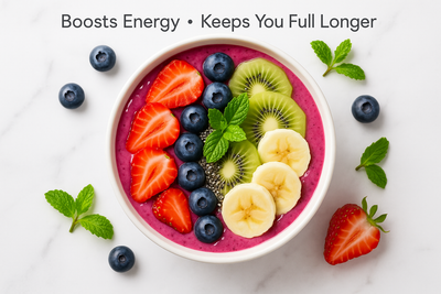  Smoothie bowl topped with chia seeds, fruits, and mint leaves in a fresh and colorful setting. Text overlay: "Boosts Energy • Keeps You Full Longer".